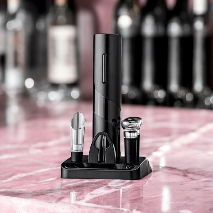 Electric wine opener set with base on a pink marble surface